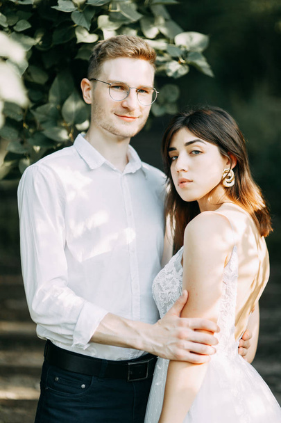 Happy couple outdoors at sunset. A stylish wedding in the European style of fine art.  - Foto, Imagem