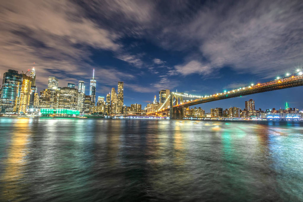 Skyline of Manhattan and Brooklyn bridge, night view - Photo, Image