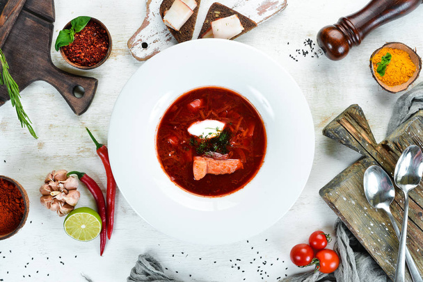 Borsch. Beet soup. Ukrainian cuisine. On a wooden background. Top view. Free space for your text. - Фото, изображение