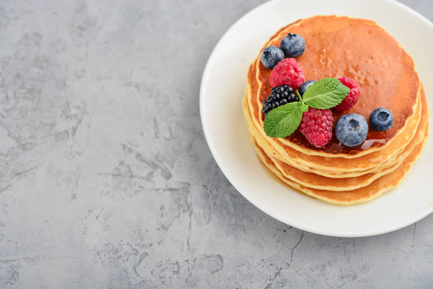 Pancakes with fresh berries and maple syrup - Photo, Image