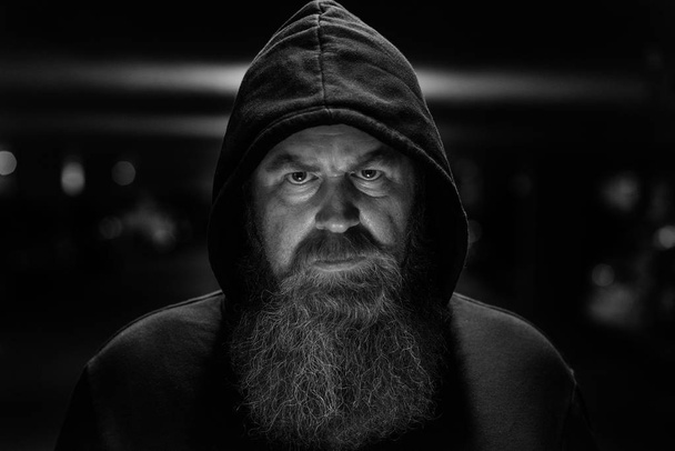 Dark shadowy portrait of a bearded man - Photo, Image