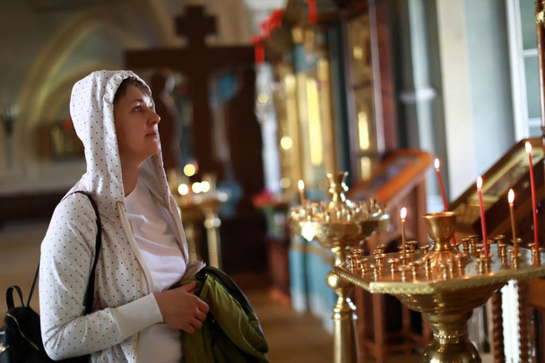 Portrait of woman in orthodox church - 写真・画像