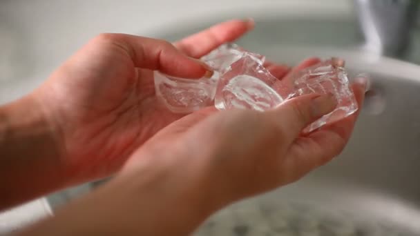 Ice cubes in his hands - Video, Çekim