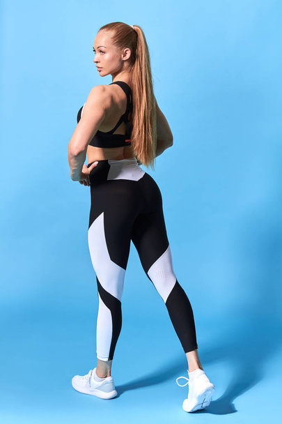 healthy slim young woman with ponytail in fashion sportswear - Fotografie, Obrázek