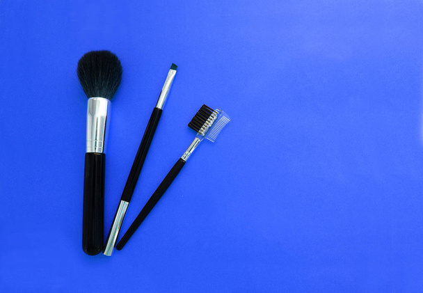 A set of brushes for makeup on a bright background. - Photo, Image
