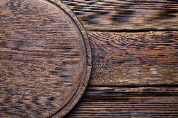 Wooden cutting board on old planks - Zdjęcie, obraz