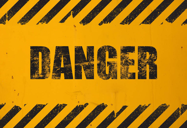 Yellow background with black grunge danger sign - Photo, Image