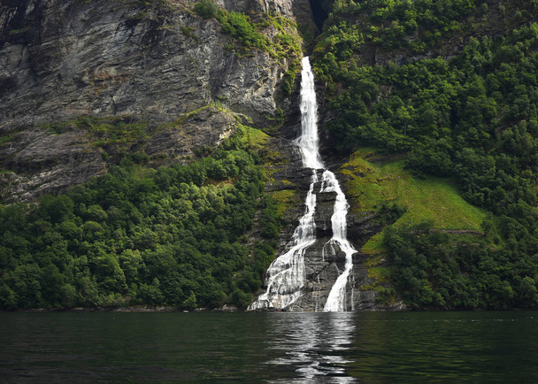 The Seven Sisters unique waterfall at Geirangerfjord seens by boat trip, Sunnmore region, Norway,  most beautiful fjords in the world, included on the UNESCO World Heritage. - Fotó, kép