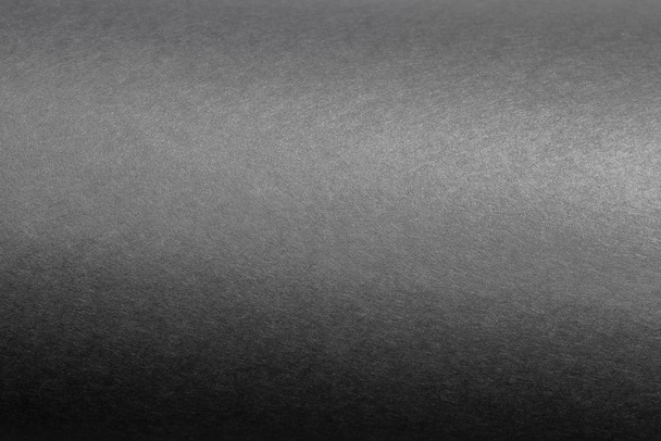zwarte roller gemaakt met gebogen vellen papier achtergrond textuur - Foto, afbeelding