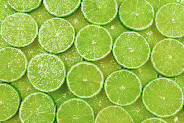 Fresh lime slices as a background.  - Photo, Image