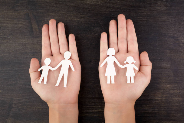 Broken family concept, divorce. Child hands with broken paper cut fmily - Photo, Image