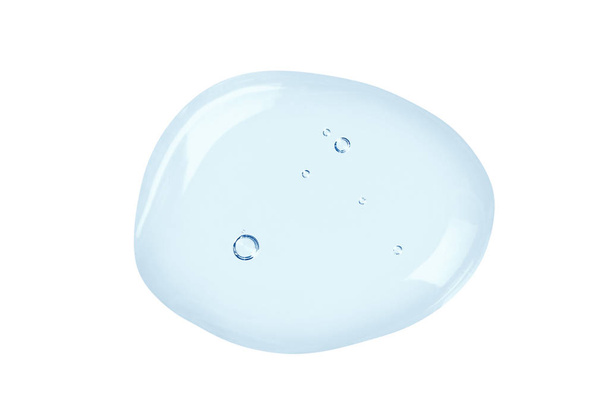 Textura azul gel cosmético com bolhas. Queda de líquido transparente isolada no fundo branco
 - Foto, Imagem