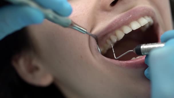 Pretty womans teeth treatment in dental clinic - Felvétel, videó