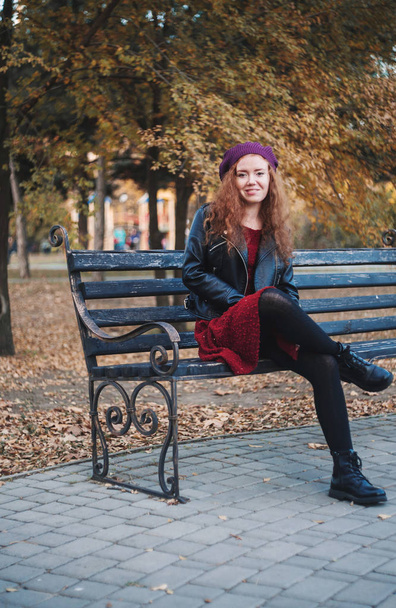 Beautiful red haired woman outdoors . Autumn mood. - Photo, Image