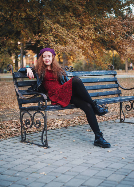 Beautiful red haired woman outdoors . Autumn mood. - Photo, image