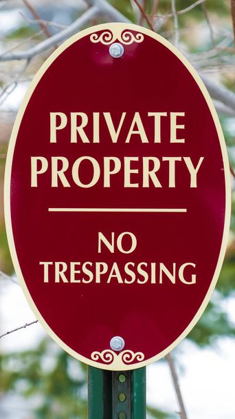 Vertical Oval shape Private Property No Trespassing sign with red and white colors - Photo, Image
