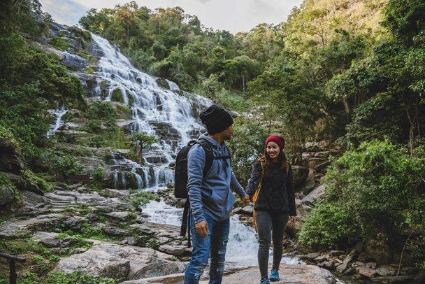 Travel relax to visit the waterfalls of couples. In the winter. at the waterfall mae ya chiangmai in thailand. travel nature. summer - Fotó, kép