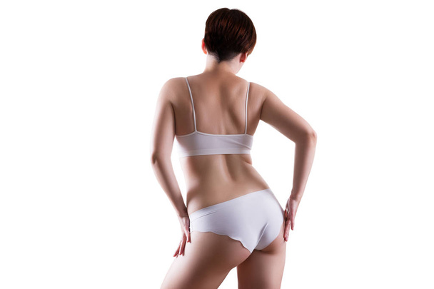 Slim sexy woman in white underwear isolated on white background, perfect female body - Valokuva, kuva