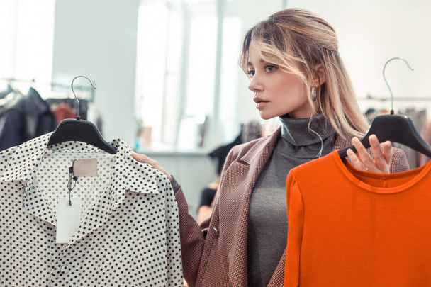 Woman wearing grey polo neck and jacket shopping after work - Fotoğraf, Görsel