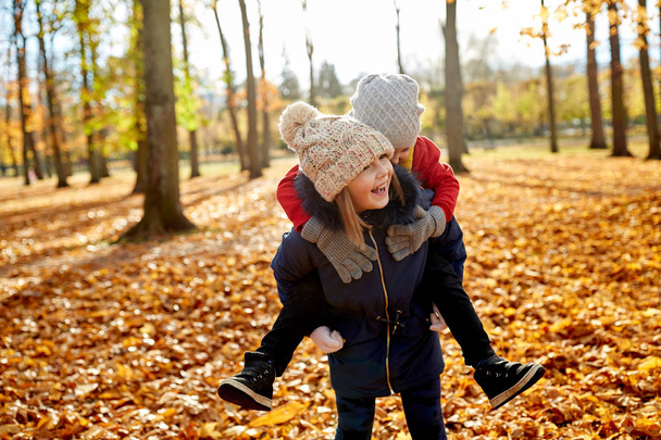happy children having fun at autumn park - Foto, immagini