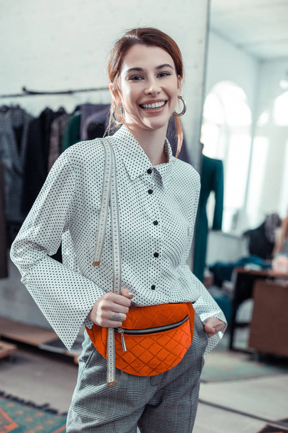 Shopping assistant smiling while enjoying working day - Fotoğraf, Görsel