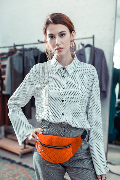 Owner of fashion boutique wearing stylish trousers and blouse - Valokuva, kuva