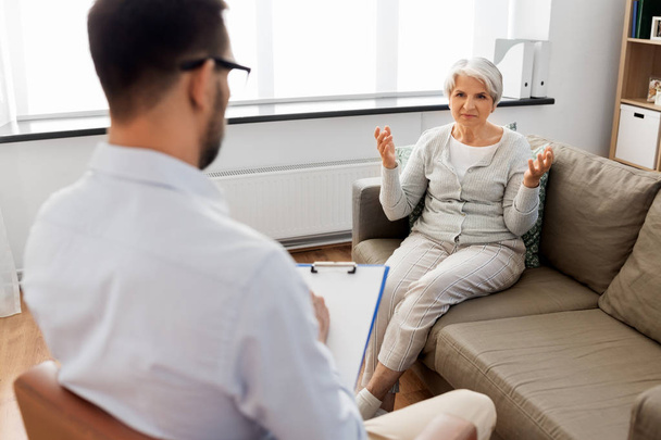 senior woman patient talking to psychologist - Fotó, kép