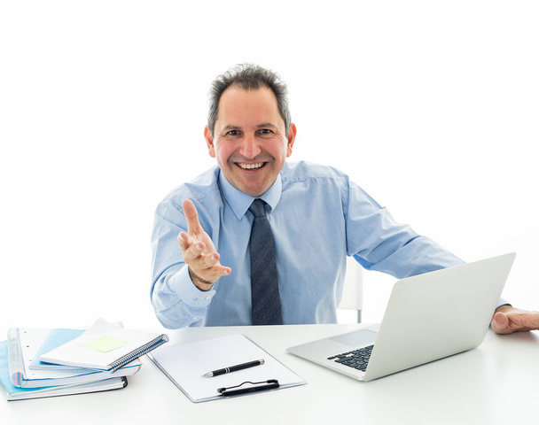 Mature businessman with laptop discussing affairs and sharing ideas looking straight at camera while working in desk office isolated on white background. Creative Career and success at work concept. - Foto, imagen