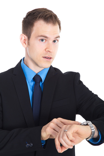 Uomo d'affari in giacca e cravatta guardando il suo orologio
 - Foto, immagini