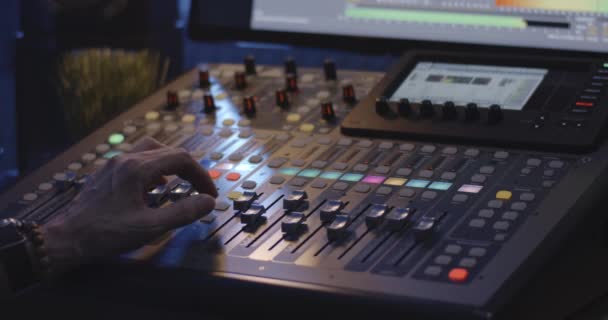 Sound engineer operating mixing console - Footage, Video