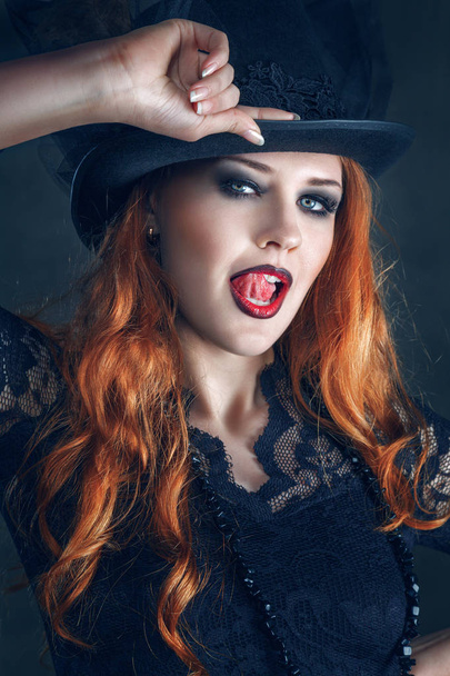 Beautiful woman portrait dressed as witch for Halloween party - Fotó, kép