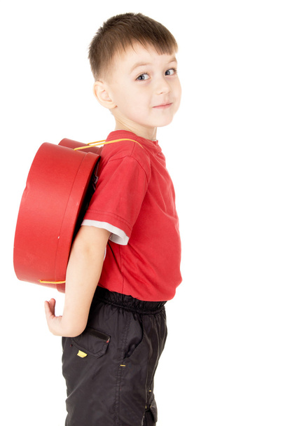 a small child stand is with a backpack in the form of heart - Foto, Imagen