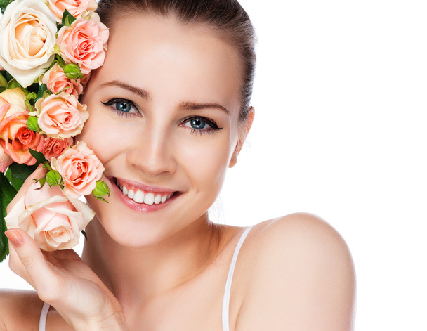portrait of attractive caucasian smiling woman blond with roses isolated on white studio shot - 写真・画像