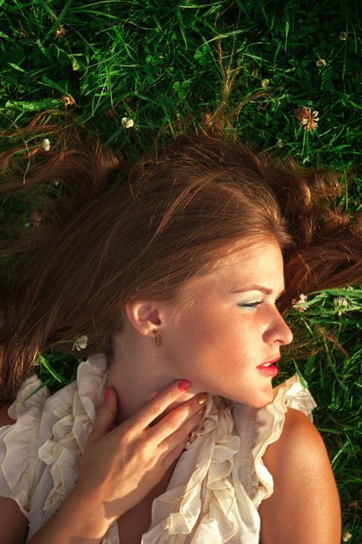 Portrait of young beautiful woman in park - 写真・画像