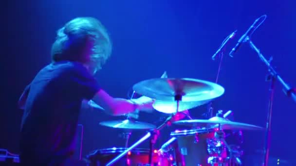 hairy rocker drummer playing music on stage, concert video  - Filmmaterial, Video