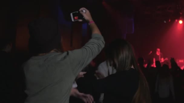 concert video, teenagers girls friends in crowd recording on mobile phone  - Footage, Video