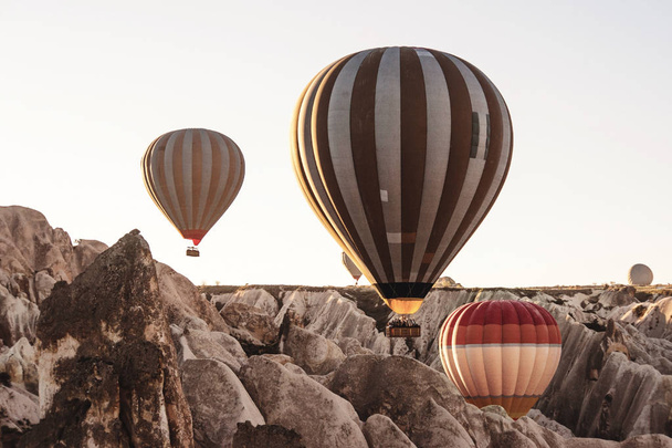 Goreme, Cappadocia, Turkey . Top view of colorful hot air balloo - Фото, изображение