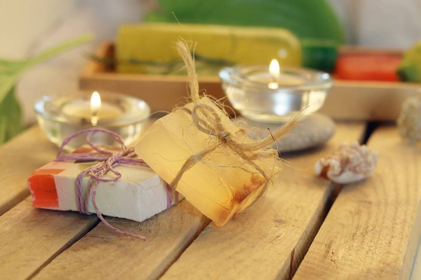 Natural soap, candles, sea salt, plants, stones, shells on the table, spa procedures, relaxation, healthy lifestyle - Photo, Image