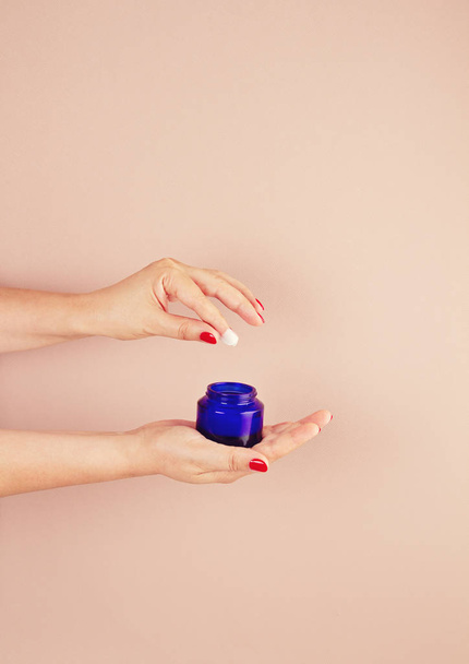 Woman hands holding skin care product - Foto, Imagem