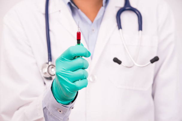 doctor hand holding medical tool,drug syringe - Fotó, kép