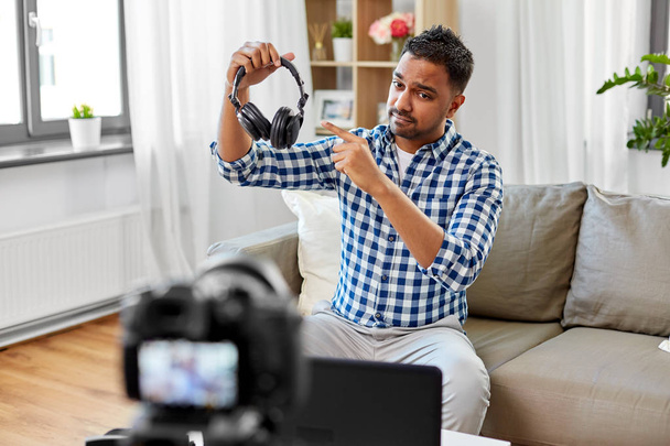 male blogger with headphones videoblogging at home - Fotoğraf, Görsel