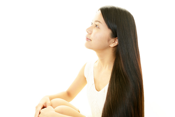 Young woman with beautiful hair - 写真・画像
