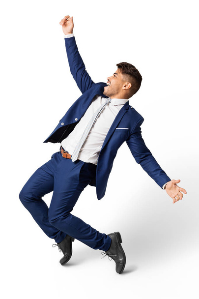 Excited Latin Businessman Dancing Over White Studio Background - Foto, Bild