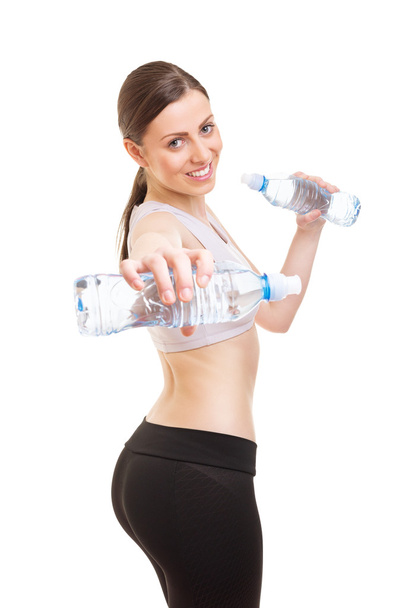 Using bottles of water as weights - Foto, afbeelding