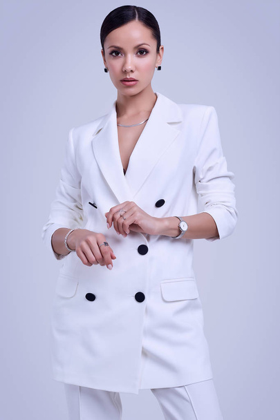 Gorgeous latin women in fashion white suit - Foto, immagini