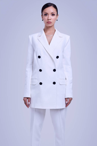 Gorgeous latin women in fashion white suit - Foto, imagen
