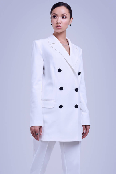 Gorgeous latin women in fashion white suit - Valokuva, kuva