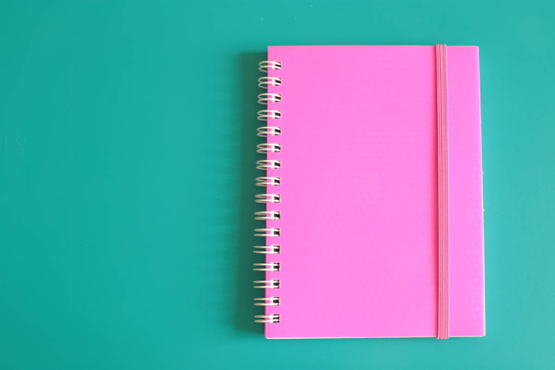 Juicy pink notepad and space for notes on a bright background - Φωτογραφία, εικόνα