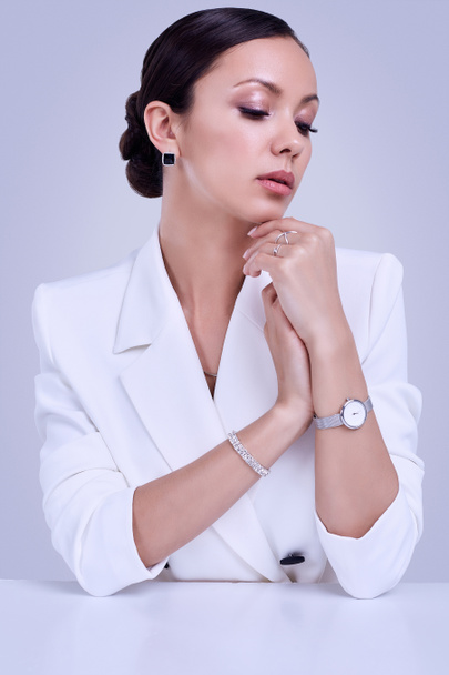 Gorgeous latin women in fashion white suit wearing expensive jew - Photo, Image
