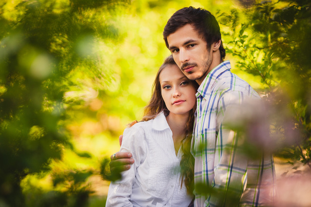 Couple in love standing at summer park - Fotografie, Obrázek